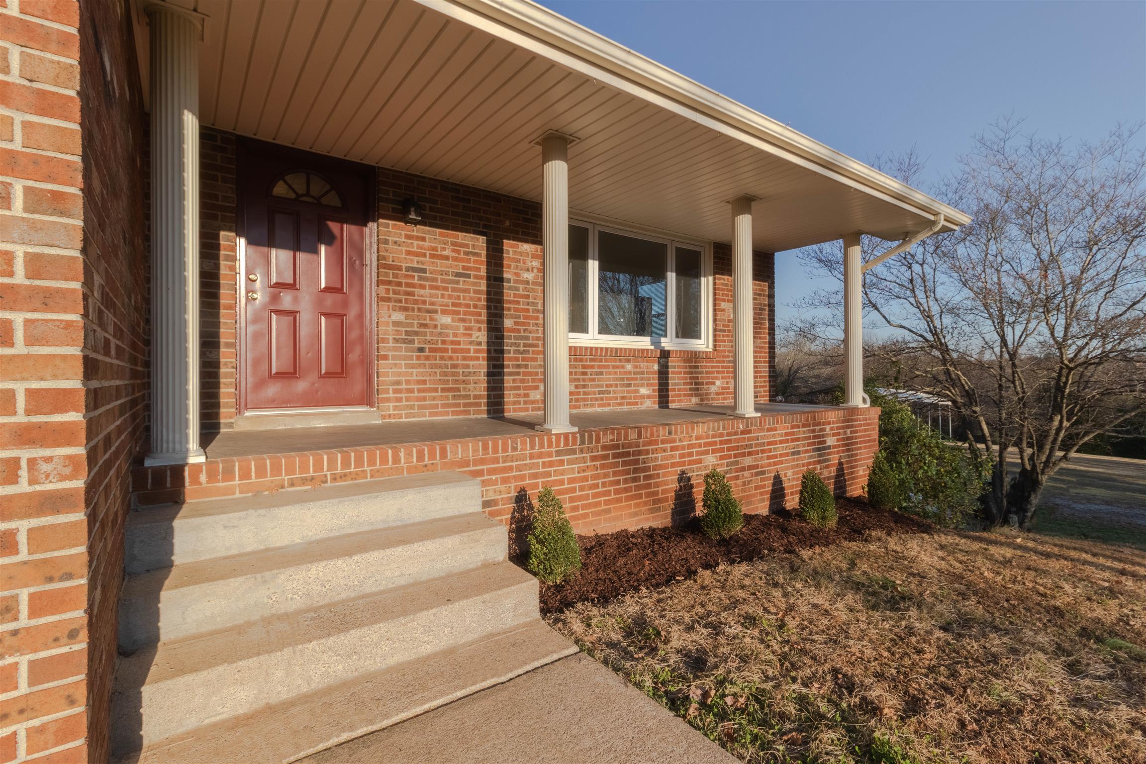 749 Durham Road Adams, TN 37010 - Photo 3 of 26 a front view of a house with a yard