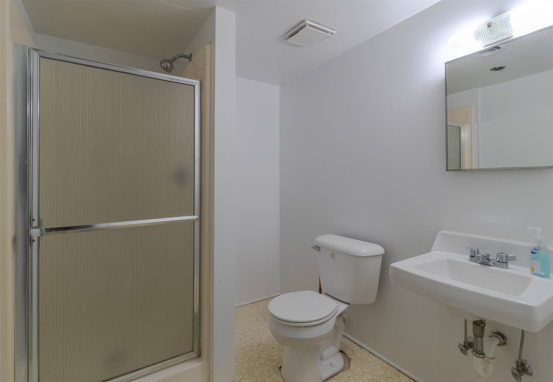 749 Durham Road Adams, TN 37010 - Photo 22 of 26 a white toilet sitting next to a bathroom sink
