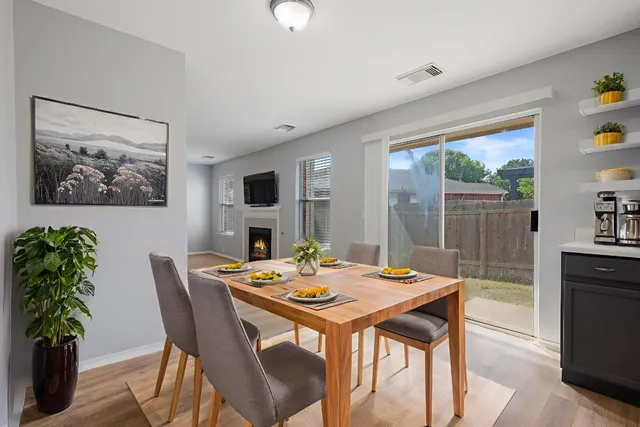 a view of a dining room with furniture window and wooden floor