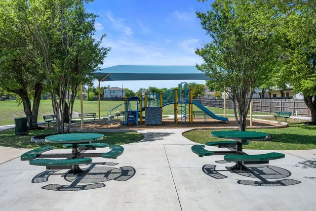 a view of a backyard with sitting area