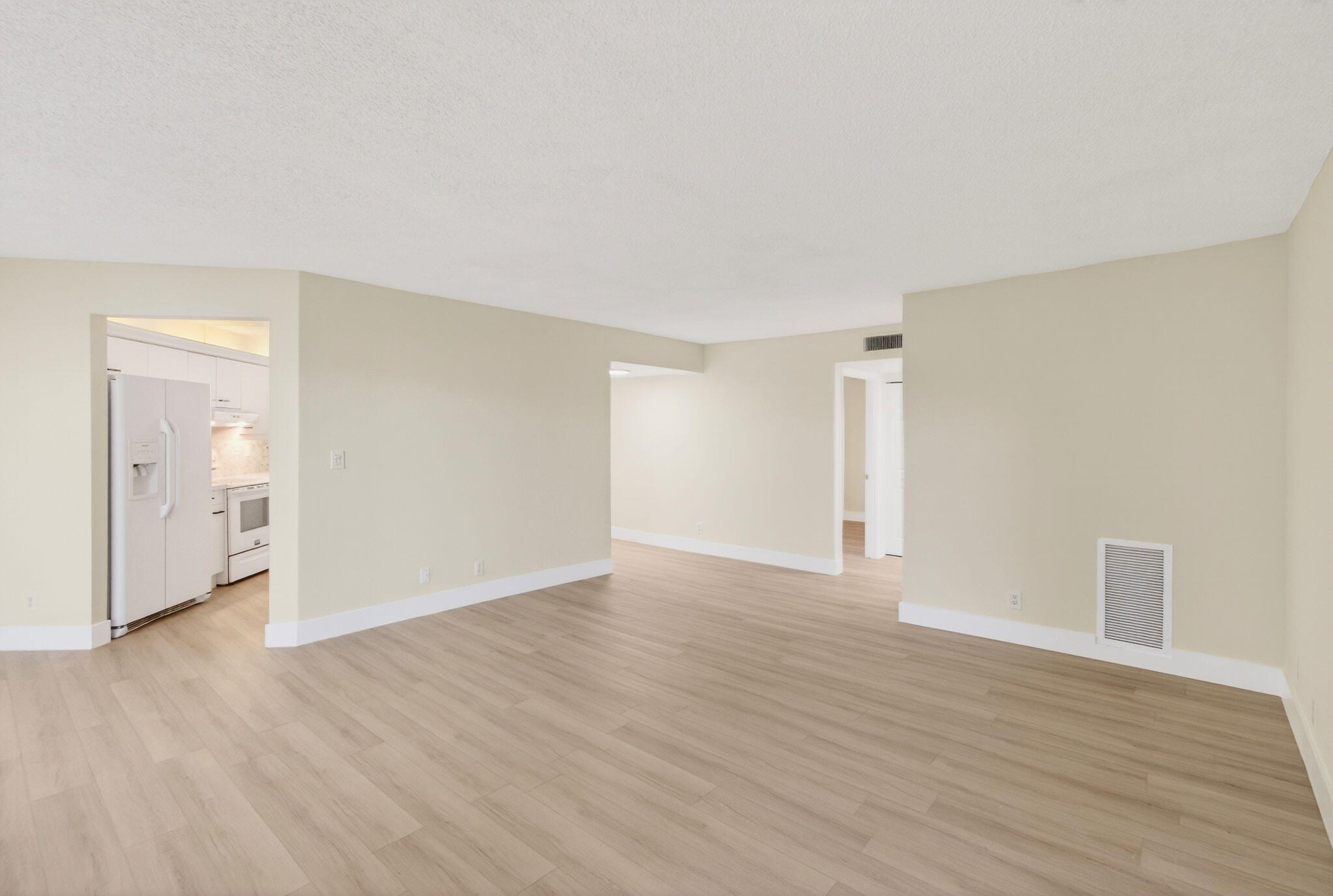 5900 Camino Del Sol, Unit 304 Boca Raton, FL 33433 - Photo 19 of 82 a view of an empty room with wooden floor and closet