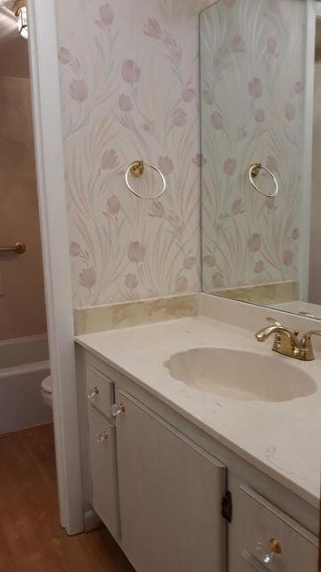 9355 Southwest 8th Street, Unit 121 Boca Raton, FL 33428 - Photo 24 of 35 a bathroom with a sink and mirror