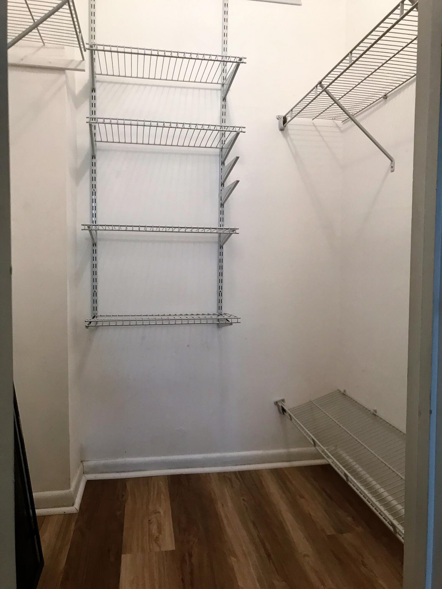 9355 Southwest 8th Street, Unit 121 Boca Raton, FL 33428 - Photo 33 of 35 a view of small space with empty racks on the wall