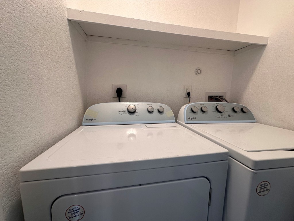 720 Neches Street Lockhart, TX 78644 - Photo 6 of 12 Laundry area featuring washer and dryer