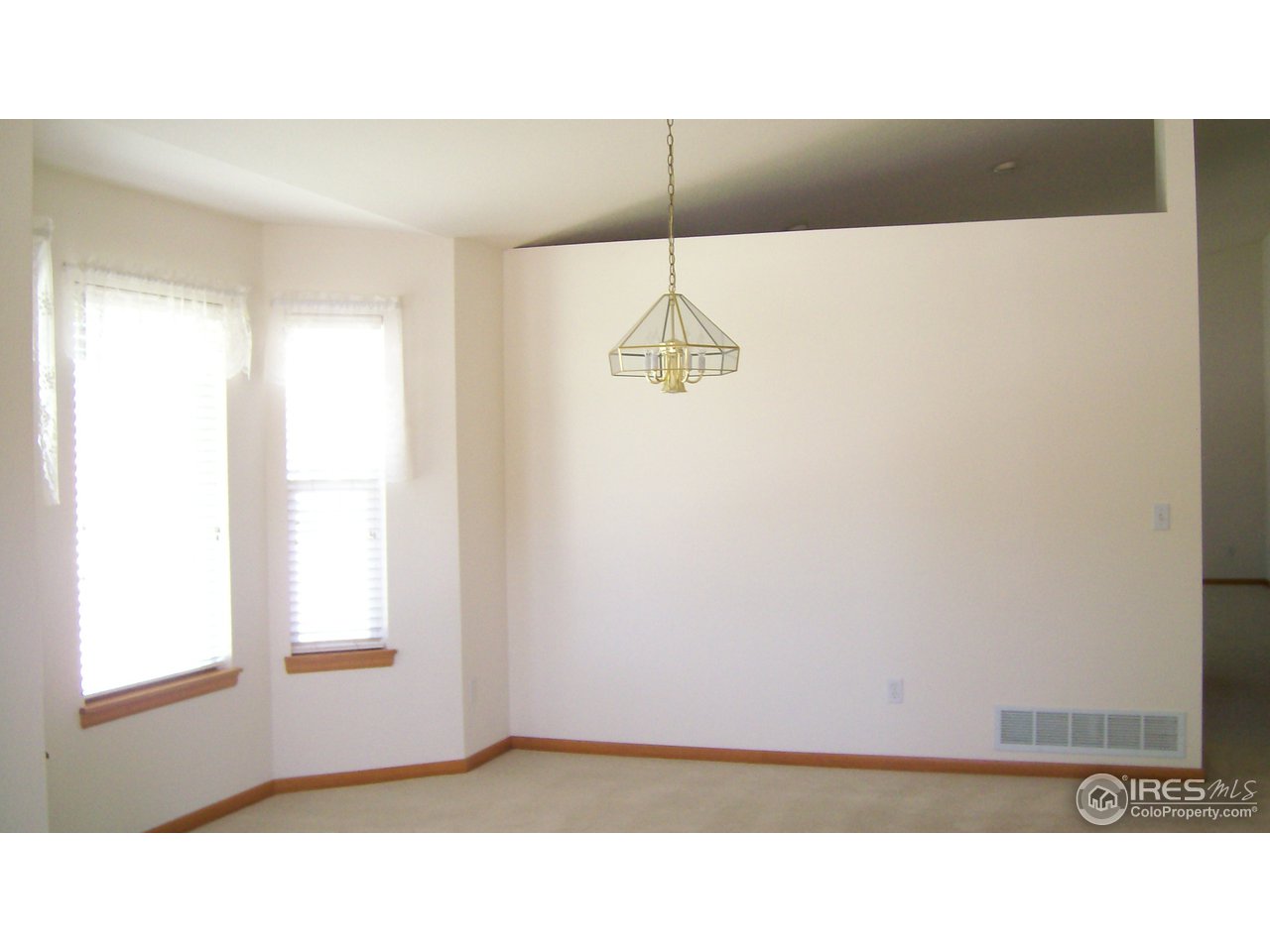 3597 West 21st Street Road Greeley, CO 80634 - Photo 12 of 12 a black and white photo of a living room