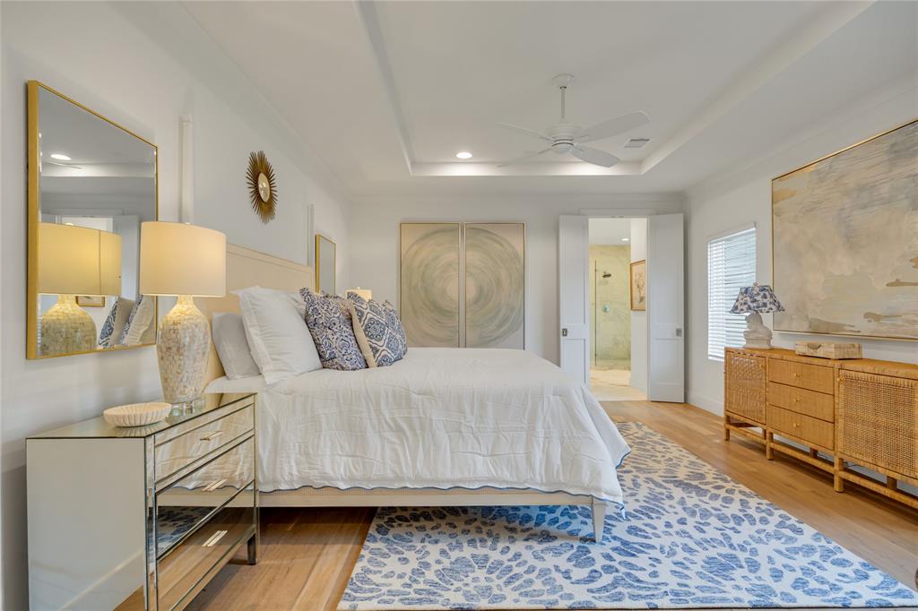 5552 Longview Street Dallas, TX 75206 - Photo 6 of 36 This spacious primary bedroom! (This is a king sized bed and has two large nightstands with room to spare). You can see the entrance to the primary marble bath as well.