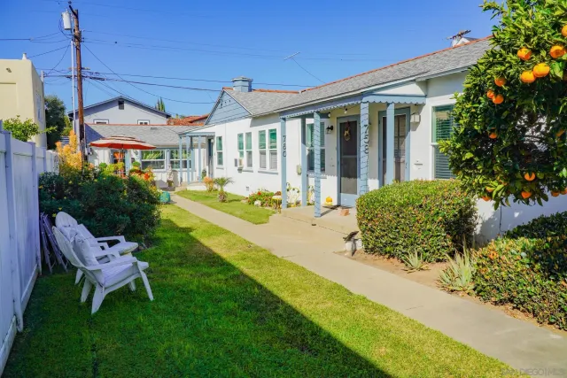 a front view of a house with garden and porch