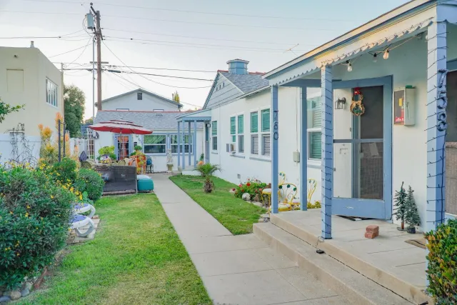 a front view of a house with garden