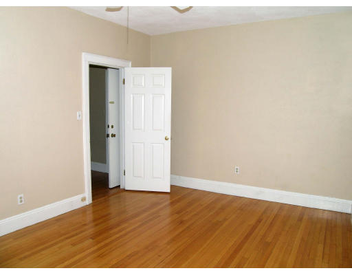 8 Chiswick Road, Unit 35 Boston, MA 02135 - Photo 13 of 16 a view of an empty room with wooden floor