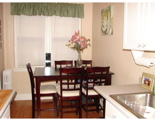 8 Chiswick Road, Unit 35 Boston, MA 02135 - Photo 7 of 16 a view of a dining room with furniture and a potted plant