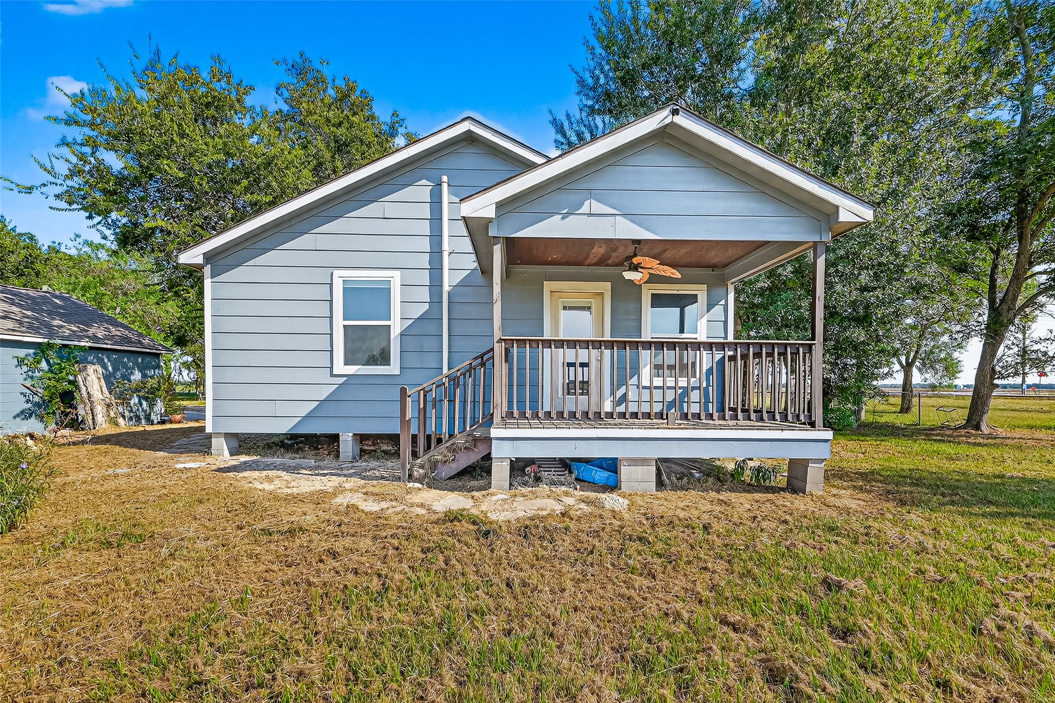 6434 Boothline Road Richmond, TX 77469 - Photo 28 of 36 a view of a house with a yard and a garden