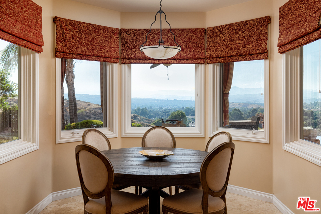 24533 Desert Avenue Newhall, CA 91321 - Photo 14 of 48 a view of a dining room with furniture window and outside view