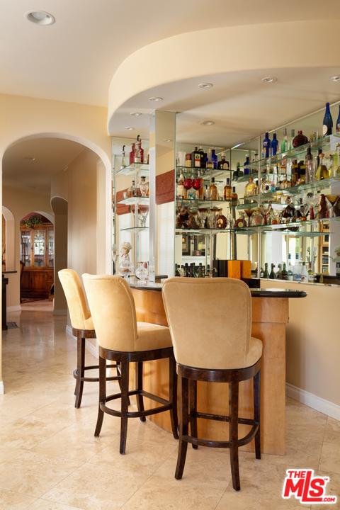 24533 Desert Avenue Newhall, CA 91321 - Photo 16 of 48 a dining room with table and chairs
