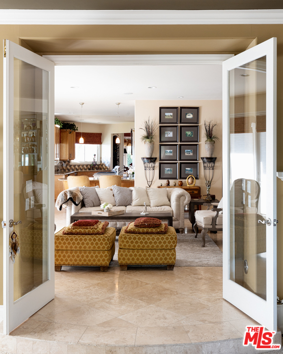 24533 Desert Avenue Newhall, CA 91321 - Photo 18 of 48 a living room with furniture and a floor to ceiling window