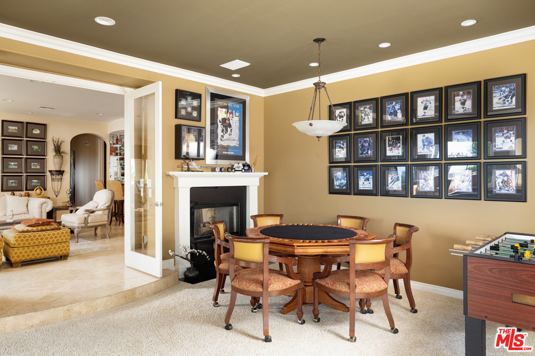 24533 Desert Avenue Newhall, CA 91321 - Photo 19 of 48 a dining room with a table and chairs