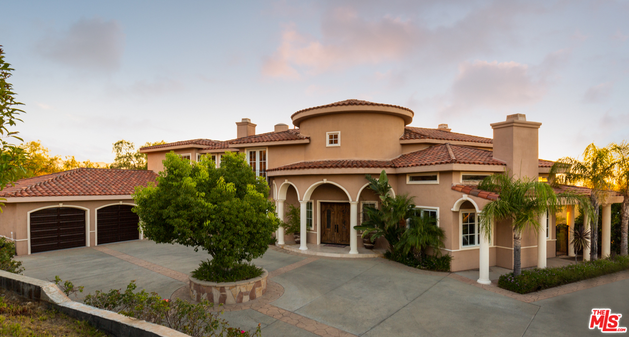 24533 Desert Avenue Newhall, CA 91321 - Photo 2 of 48 a front view of a house with yard