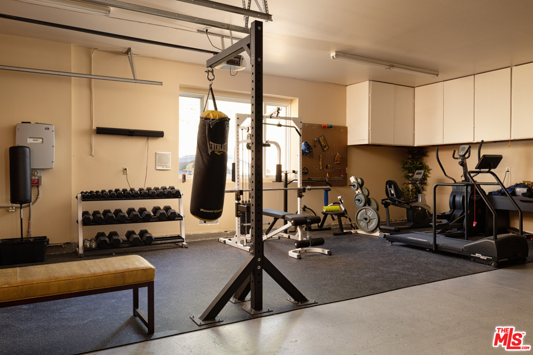 24533 Desert Avenue Newhall, CA 91321 - Photo 24 of 48 a view of a room with gym equipment