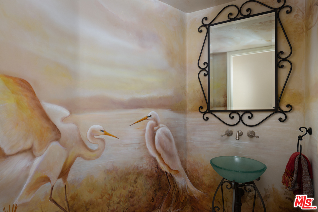 24533 Desert Avenue Newhall, CA 91321 - Photo 25 of 48 a bathroom with a sink and a mirror