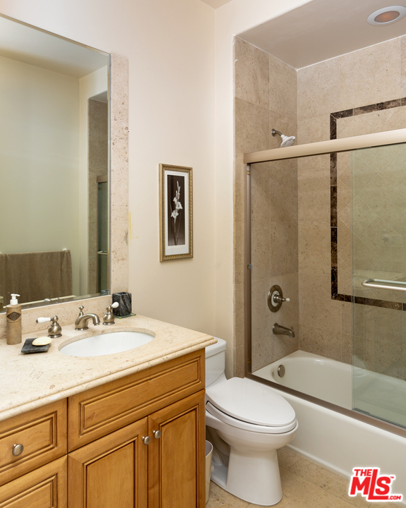 24533 Desert Avenue Newhall, CA 91321 - Photo 29 of 48 a bathroom with a sink a toilet and shower