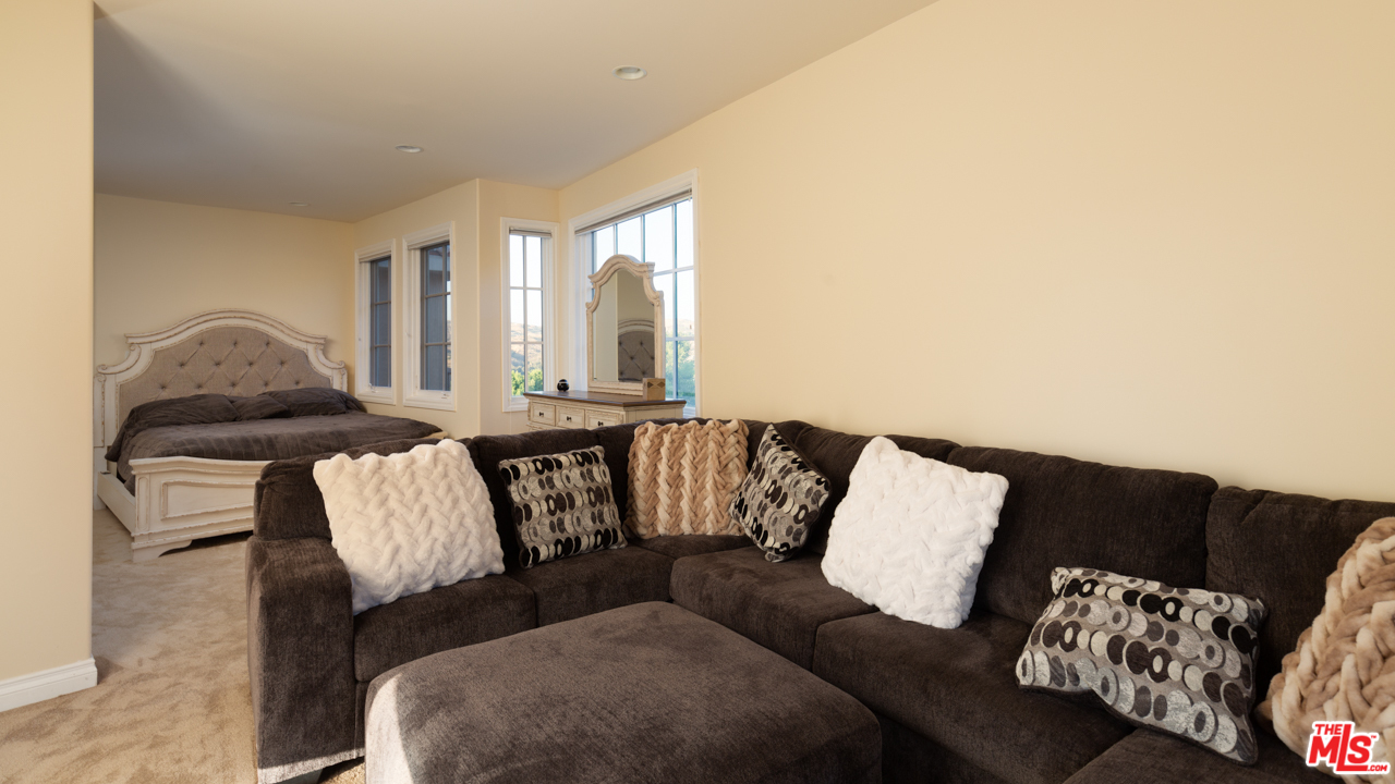 24533 Desert Avenue Newhall, CA 91321 - Photo 31 of 48 a living room with furniture and a large window