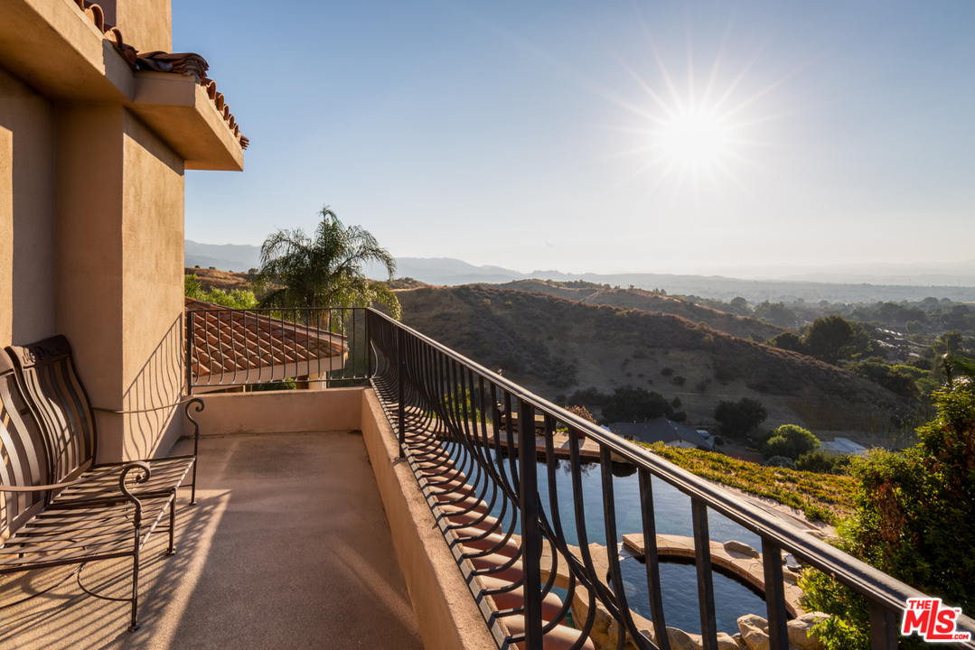 24533 Desert Avenue Newhall, CA 91321 - Photo 37 of 48 a view of a balcony with wooden floor and fence