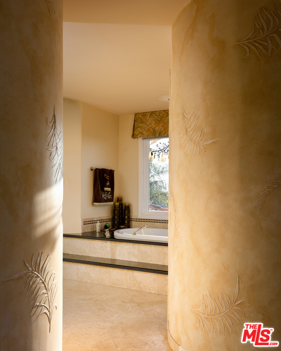 24533 Desert Avenue Newhall, CA 91321 - Photo 39 of 48 a living room with a couch and a flat screen tv