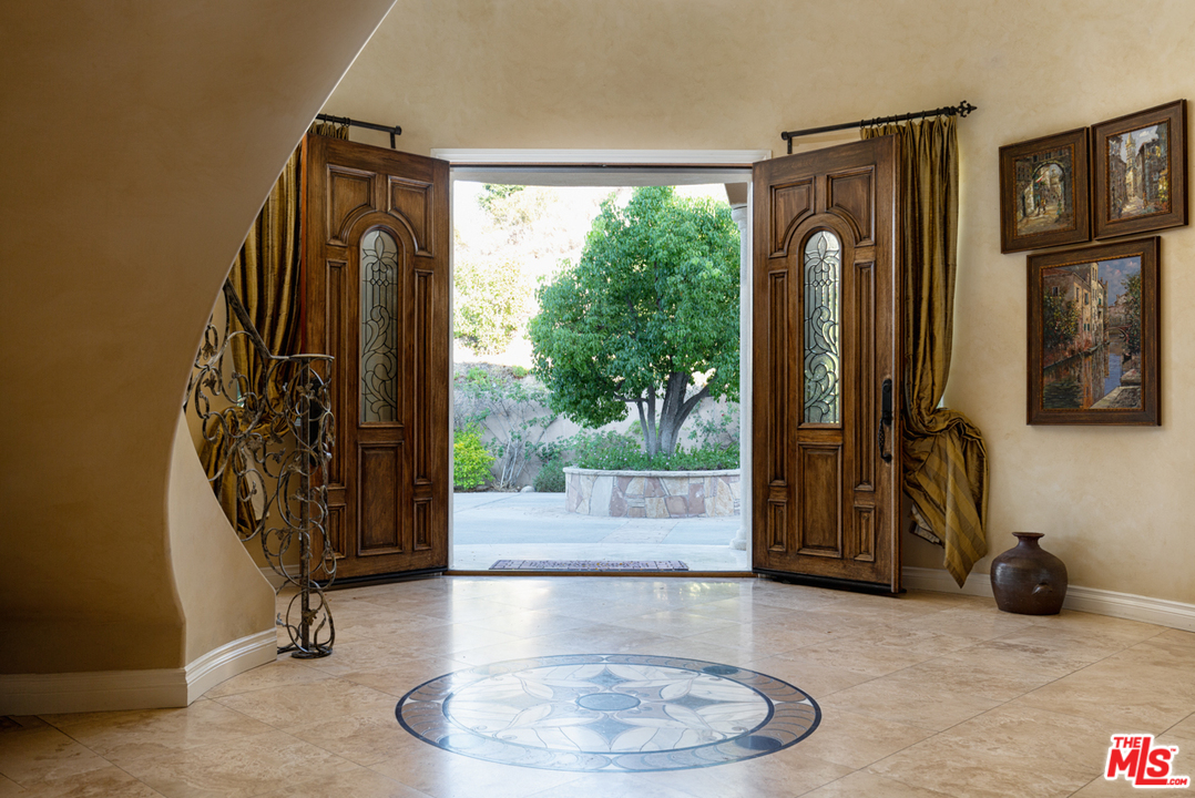 24533 Desert Avenue Newhall, CA 91321 - Photo 5 of 48 a view of a entryway door with living room