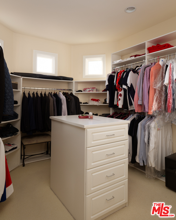 24533 Desert Avenue Newhall, CA 91321 - Photo 41 of 48 a view of walk in closet with clothes and shoes