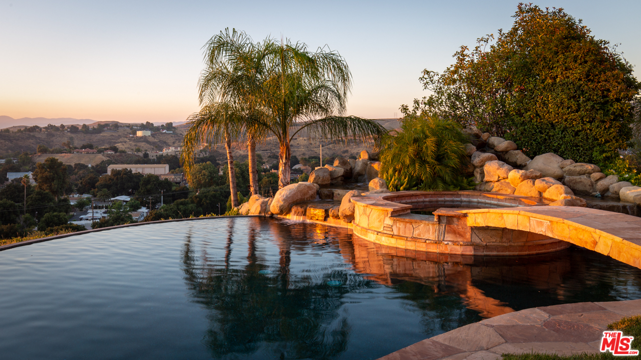 24533 Desert Avenue Newhall, CA 91321 - Photo 44 of 48 a view of a swimming pool with a yard