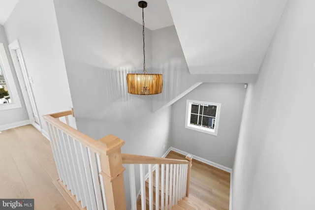a view of a house with entryway and wooden floor