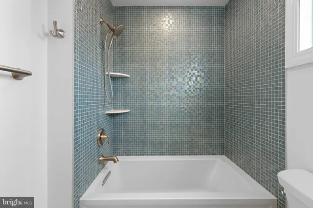 a bedroom with bed and window