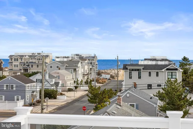 a bedroom with two beds and a window