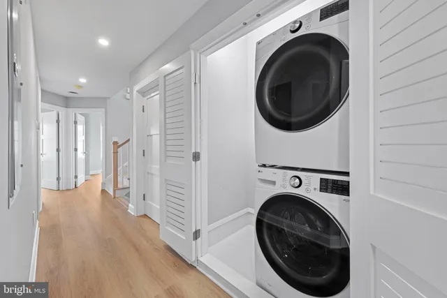 an aerial view of residential building with parking