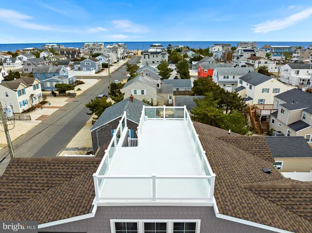 an aerial view of a house with a city view