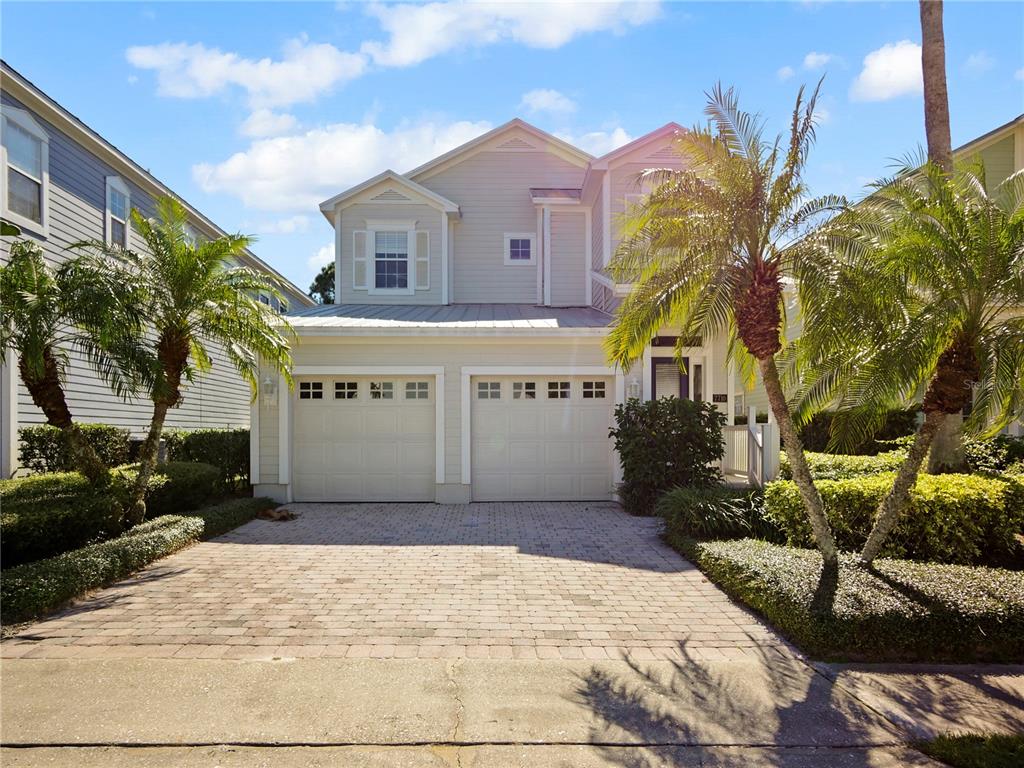 7710 Linkside Loop Reunion, FL 34747 - Photo 1 of 33 a front view of a building with garden