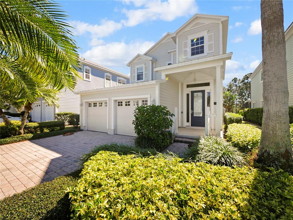 7710 Linkside Loop Reunion, FL 34747 - Photo 13 of 33 a front view of a house with garden