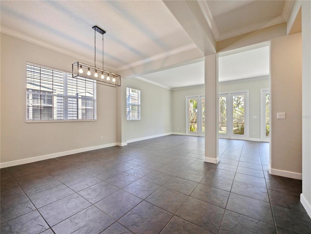 7710 Linkside Loop Reunion, FL 34747 - Photo 2 of 33 a view of an empty room with glass door