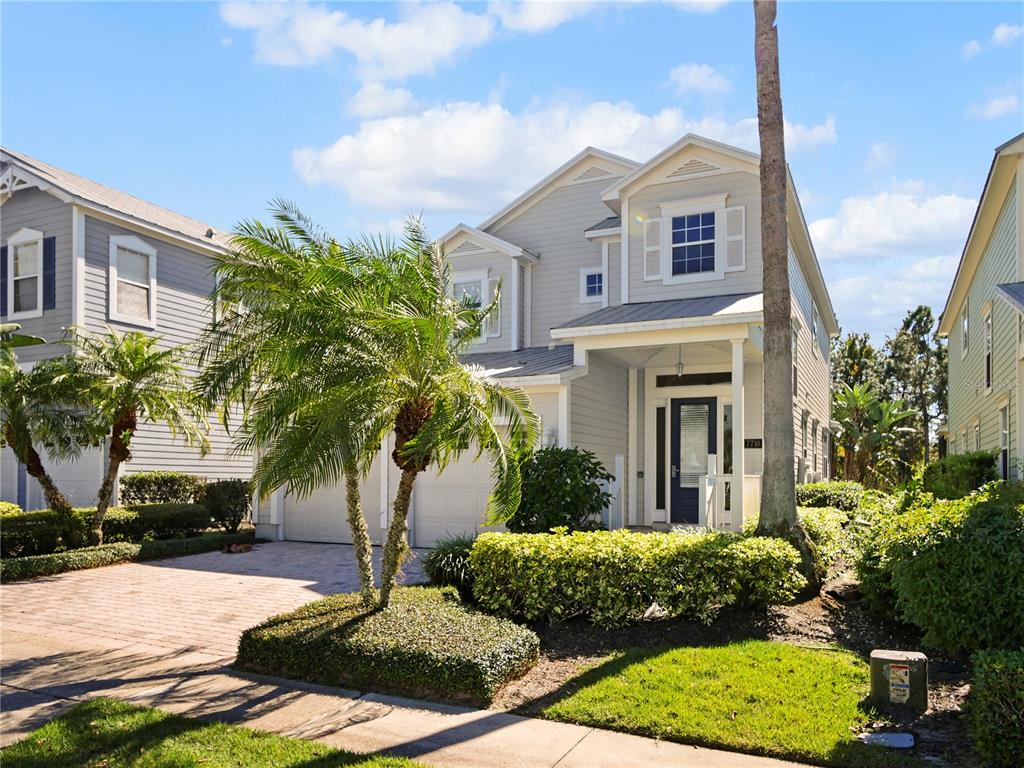 7710 Linkside Loop Reunion, FL 34747 - Photo 8 of 33 a front view of house with yard and green space