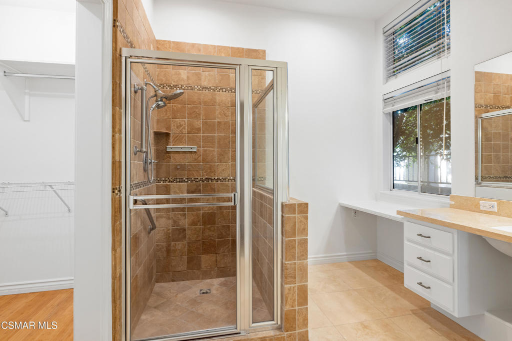 2906 Evesham Avenue Thousand Oaks, CA 91362 - Photo 18 of 30 a bathroom with a shower sink and mirror