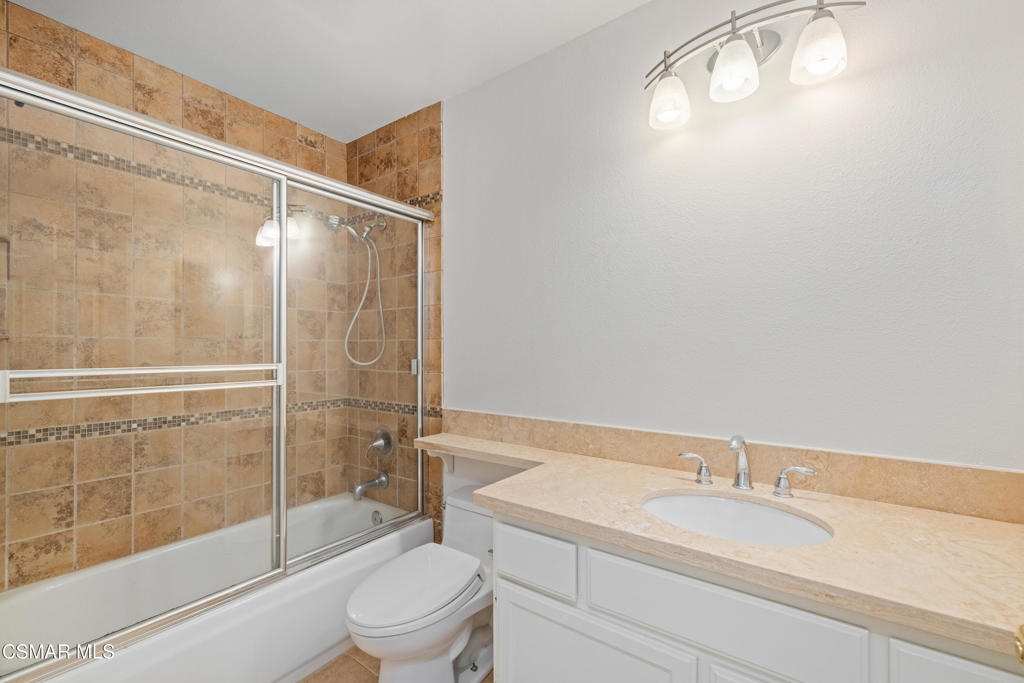 2906 Evesham Avenue Thousand Oaks, CA 91362 - Photo 22 of 30 a bathroom with a granite countertop sink toilet and shower