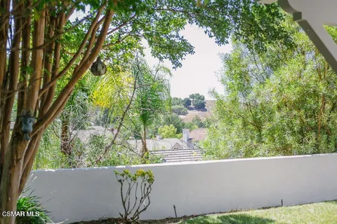 a view of a yard from a balcony
