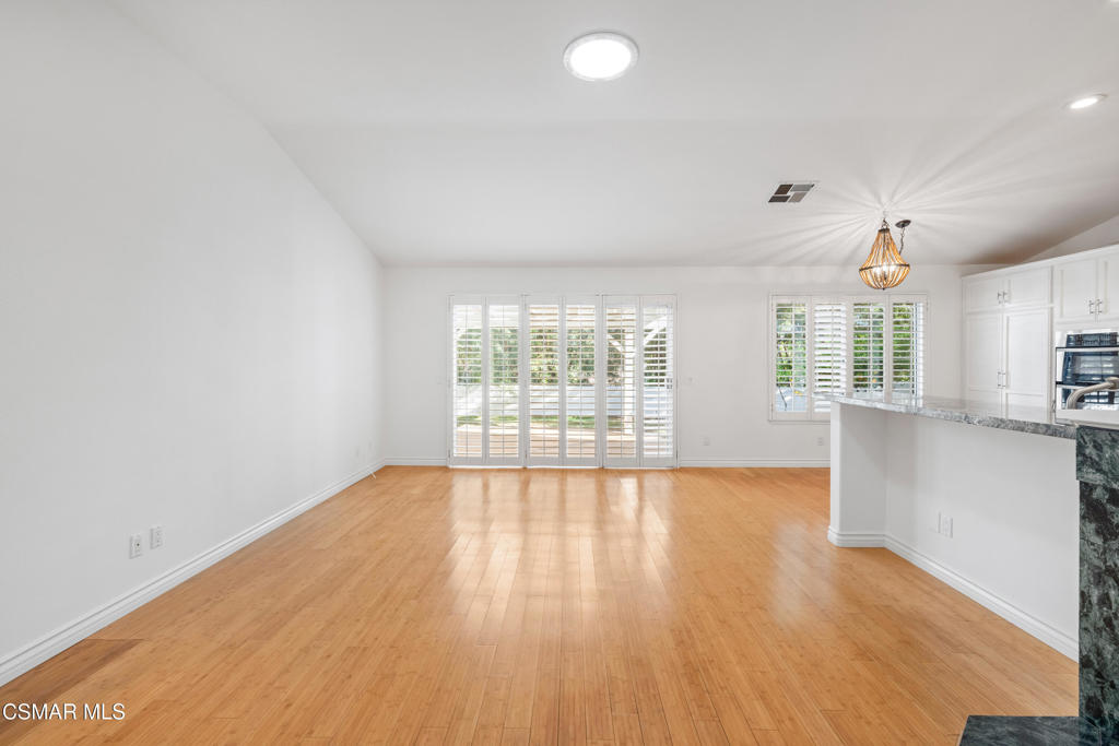 2906 Evesham Avenue Thousand Oaks, CA 91362 - Photo 7 of 30 an empty room with wooden floor and windows