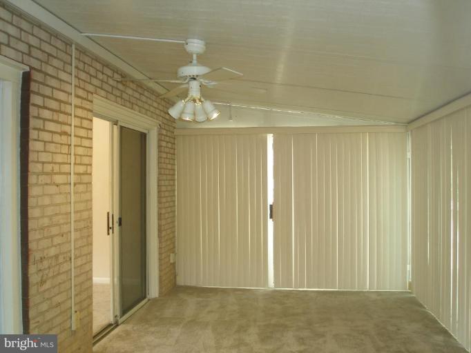 13001 Layhill Road Silver Spring, MD 20906 - Photo 13 of 19 a view of a livingroom with a chandelier fan
