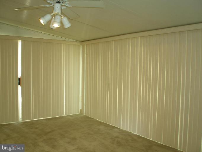 13001 Layhill Road Silver Spring, MD 20906 - Photo 4 of 19 a view of an empty room and chandelier fan