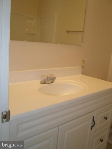 13001 Layhill Road Silver Spring, MD 20906 - Photo 5 of 19 a bathroom with a sink and a mirror