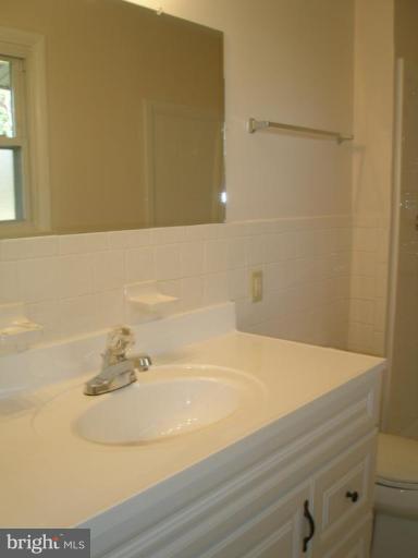 13001 Layhill Road Silver Spring, MD 20906 - Photo 6 of 19 a bathroom with a sink and a shower
