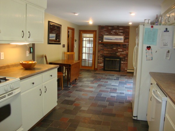 228 Braley Hill Road Rochester, MA 02770 - Photo 12 of 18 a kitchen with stainless steel appliances granite countertop a refrigerator and a stove top oven