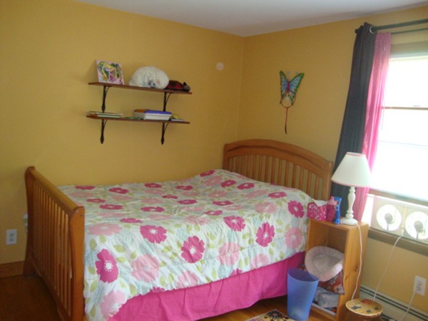 228 Braley Hill Road Rochester, MA 02770 - Photo 15 of 18 a bedroom with a bed and a dresser in it
