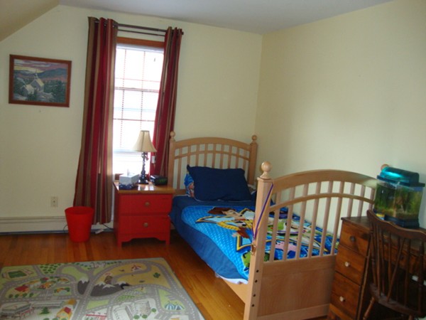 228 Braley Hill Road Rochester, MA 02770 - Photo 16 of 18 a living room with furniture fireplace and a window