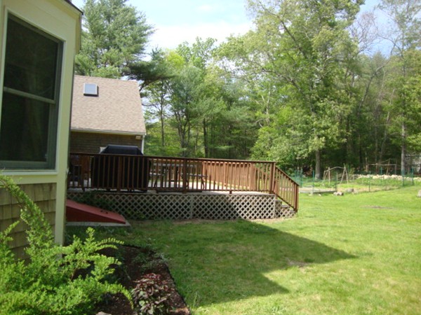 228 Braley Hill Road Rochester, MA 02770 - Photo 3 of 18 a view of a deck with a fence